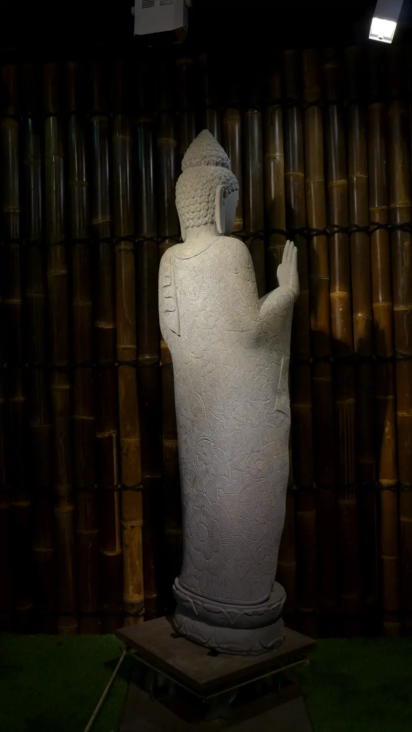  Product image 8 of the product “Standing Buddha with floral carving, Abudaya position. 43 x 39 x 175cm. Natural stone (river stone), stonemasonry ”